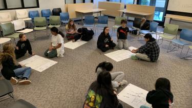 Group of students gathered on the floor